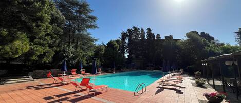 Seasonal outdoor pool, open 9:30 AM to 7:30 PM, pool umbrellas