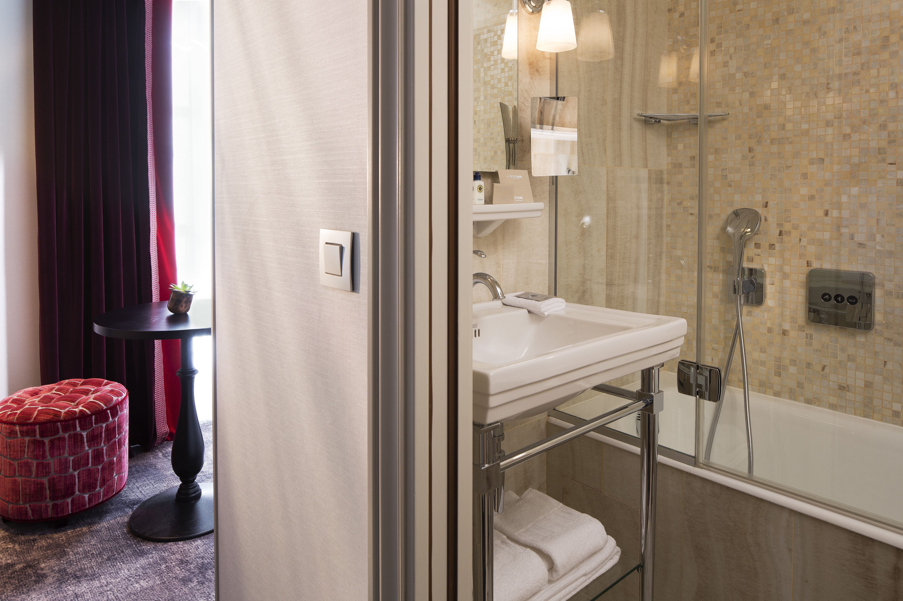deluxe double room | bathroom | rainfall showerhead, designer toiletries, hair dryer, towels
