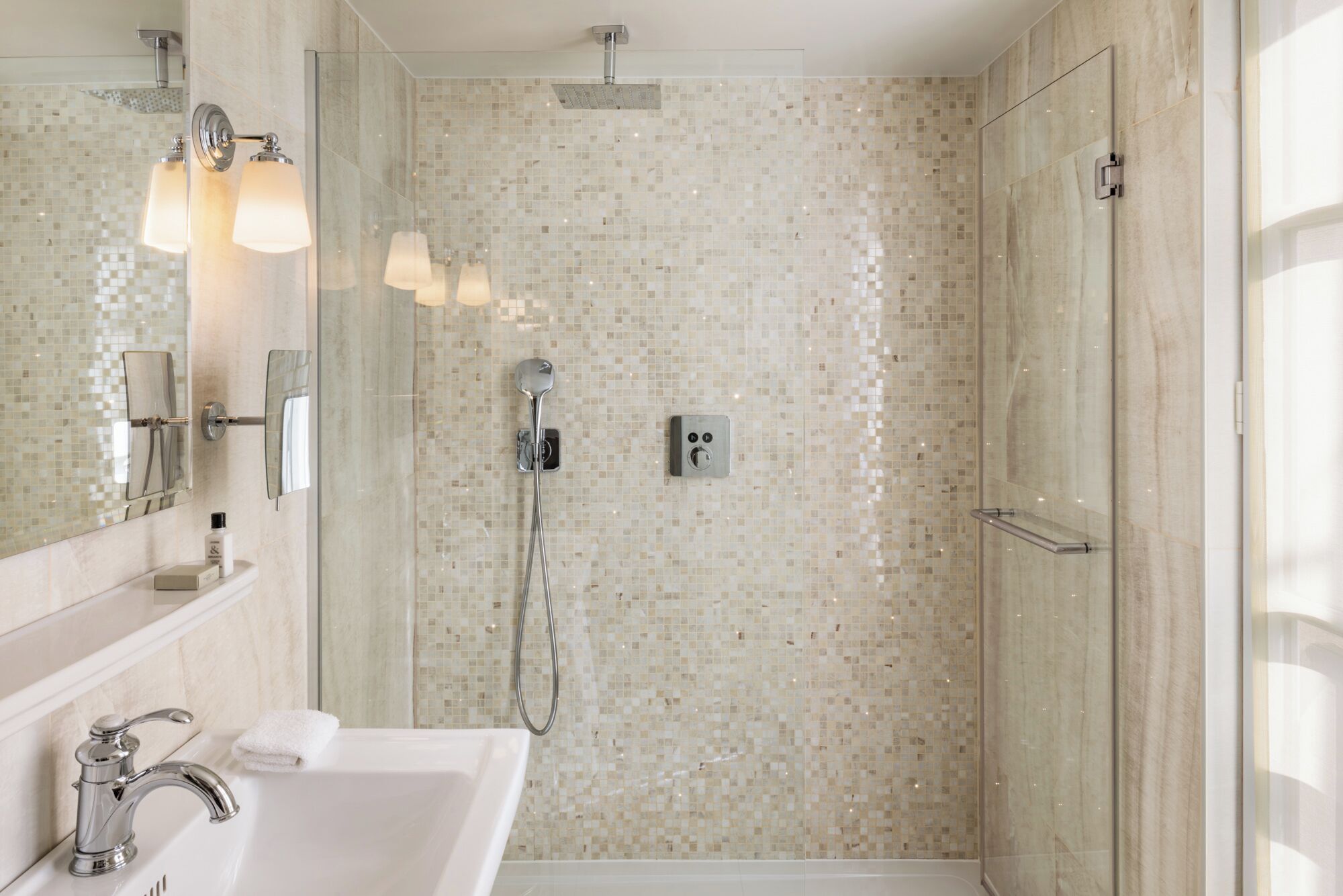 superior double room | bathroom | rainfall showerhead, designer toiletries, hair dryer, towels