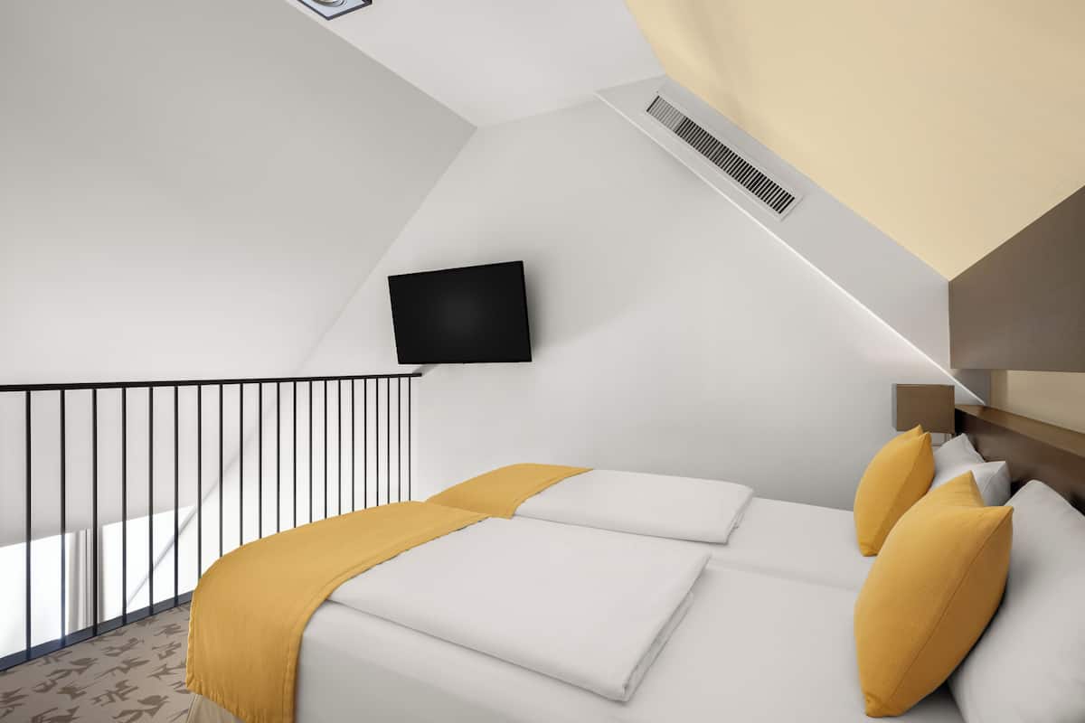 Duplex | Ropa de cama hipoalergénica y caja de seguridad en la habitación