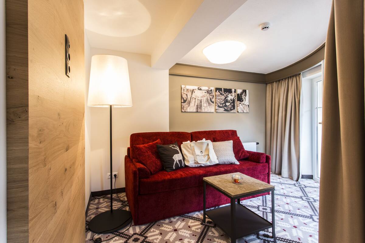 superior double room, balcony, mountain view | living area | flat-screen tv, pay films