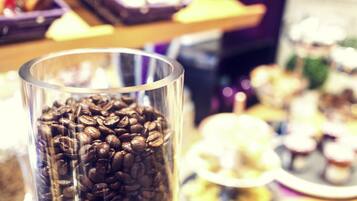 A glass filled with coffee beans.