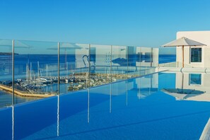 2 outdoor pools, pool umbrellas, pool loungers