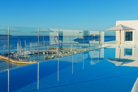 2 outdoor pools, pool umbrellas, sun loungers