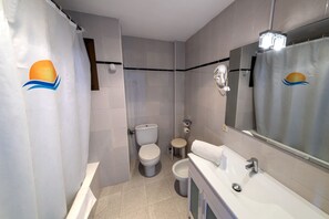 Combined shower/tub, hair dryer, towels, soap