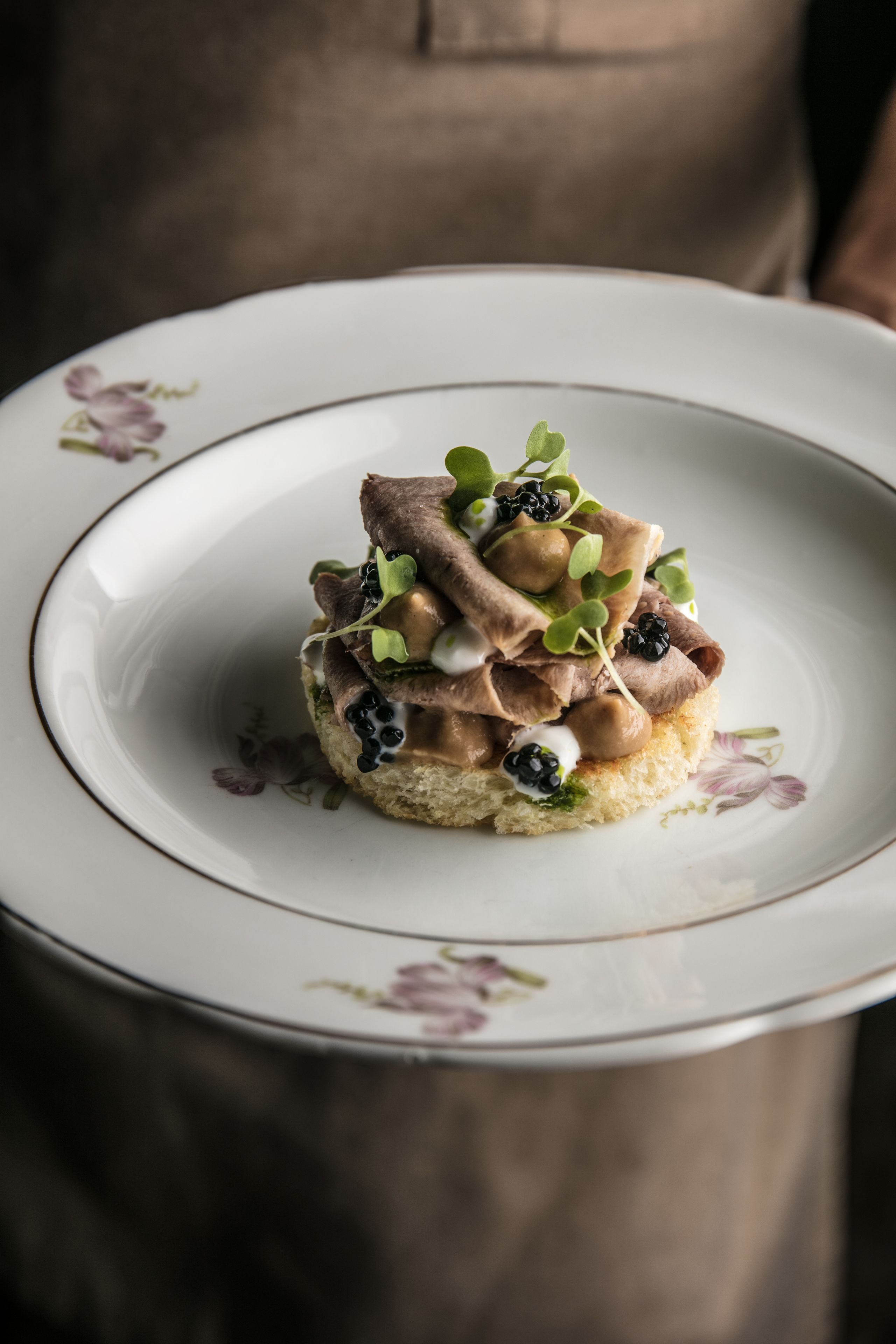 A dessert on a floral plate.