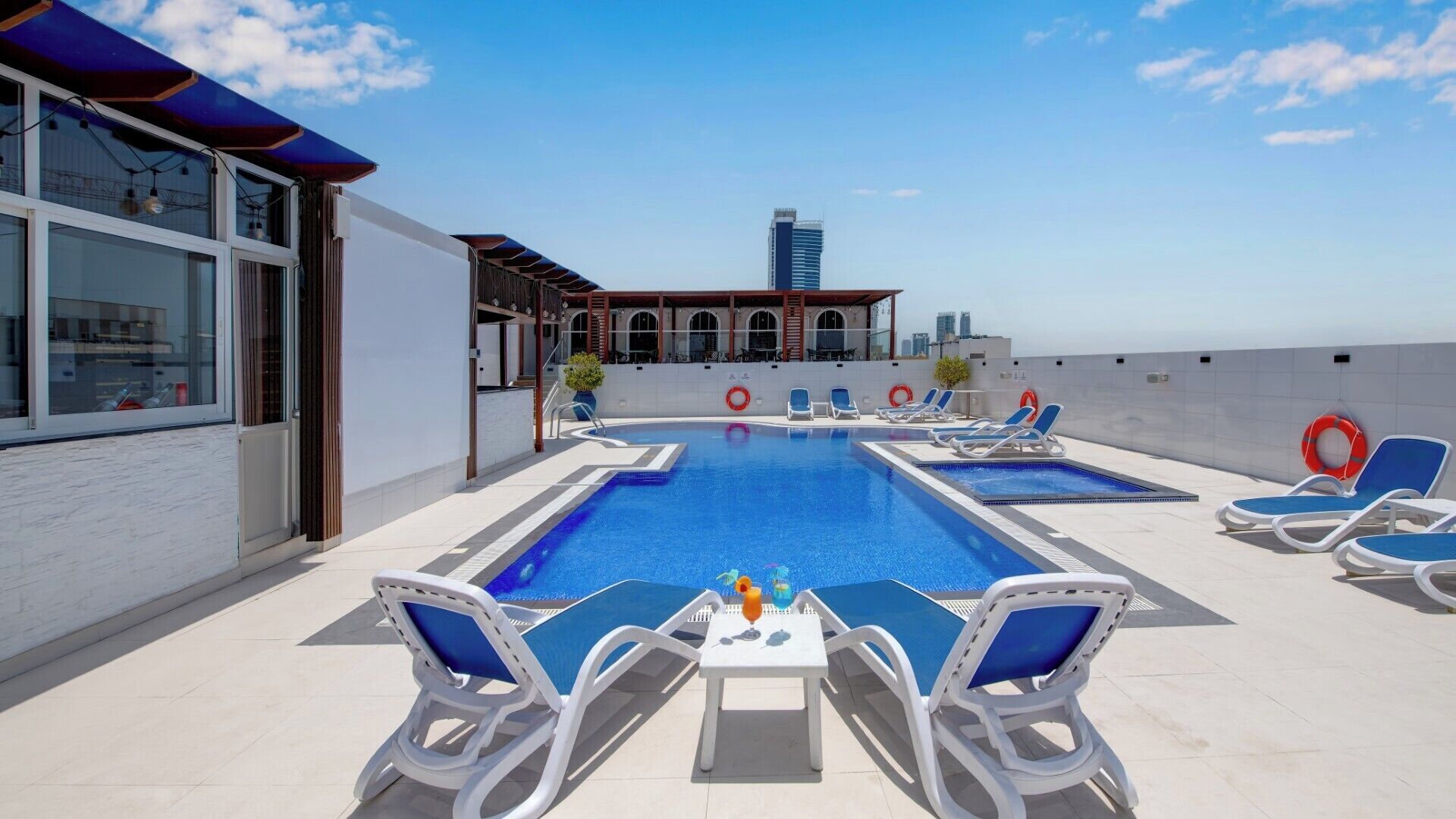 Outdoor pool, open 8:00 AM to 8:00 PM, pool loungers