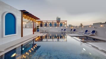 Outdoor pool, open 8:00 AM to 8:00 PM, pool loungers