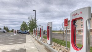 A row of Tesla electric vehicle charging stations in a parking lot. - Fairfield Inn & Suites by Marriott Laramie (Laramie)