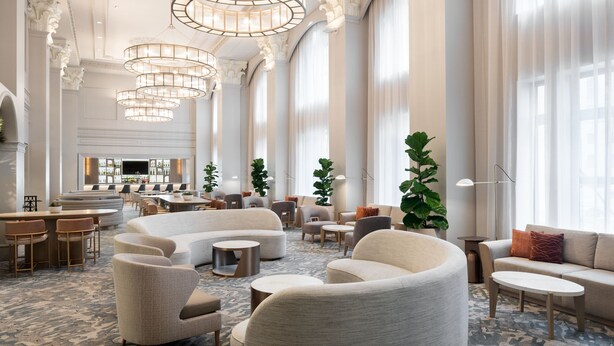 A spacious lobby with high ceilings, elegant chandeliers, and a bar area. - The Westin Book Cadillac Detroit (Detroit)