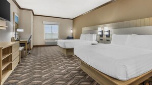 A hotel room with two beds, a desk, a TV, and a window. - Best Western Red River Inn & Suites (Thackerville)