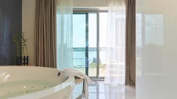 Designer toiletries, hair dryer, bathrobes, slippers