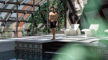 Indoor pool, pool loungers, lifeguards on site