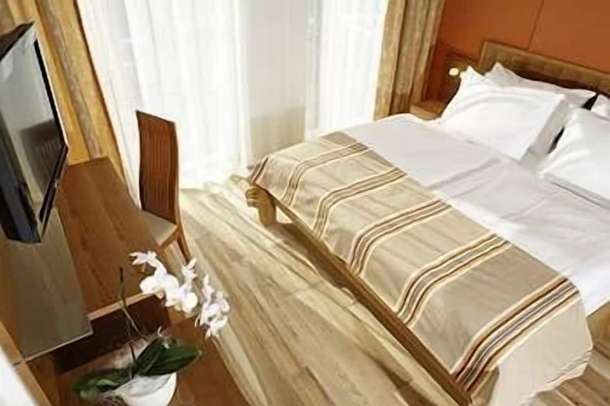 Premium bedding, pillow-top beds, desk, blackout curtains