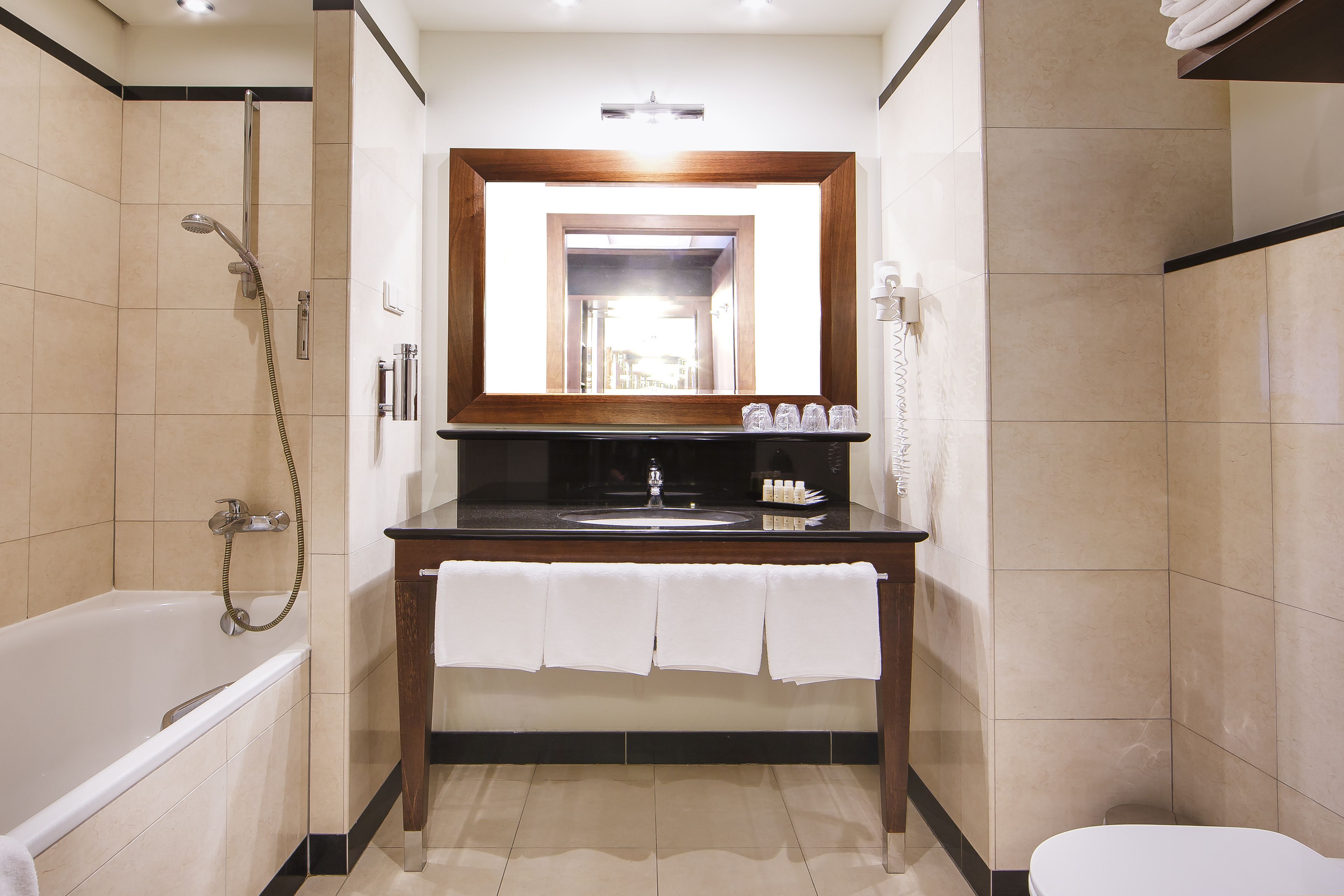 combined shower/bathtub, free toiletries, hair dryer, slippers