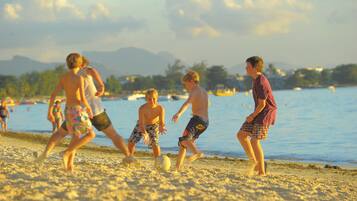 Guests can enjoy a game of soccer on the sandy beach.