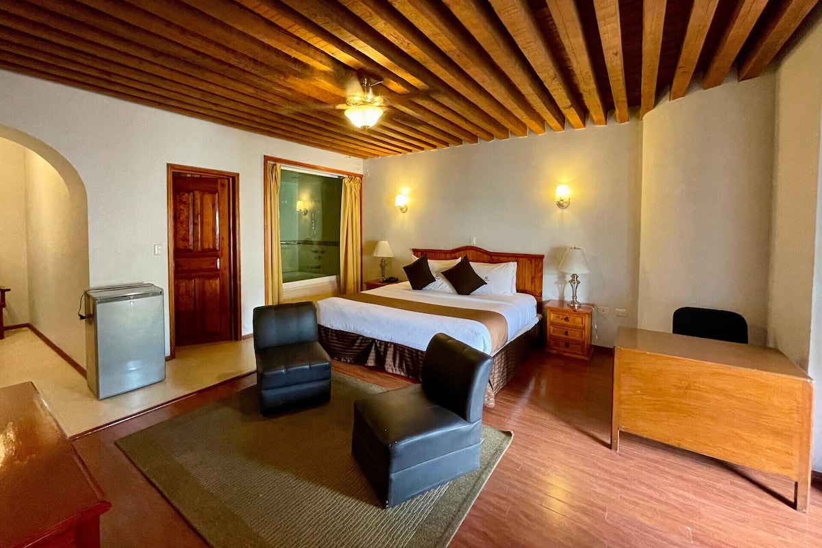 Premium bedding, desk, laptop workspace, blackout drapes