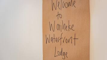 A handwritten sign welcoming visitors to Waterfront Lodge.