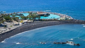 On the beach, black sand