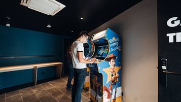 Relax in a themed area with a colorful poster and comfortable seating.