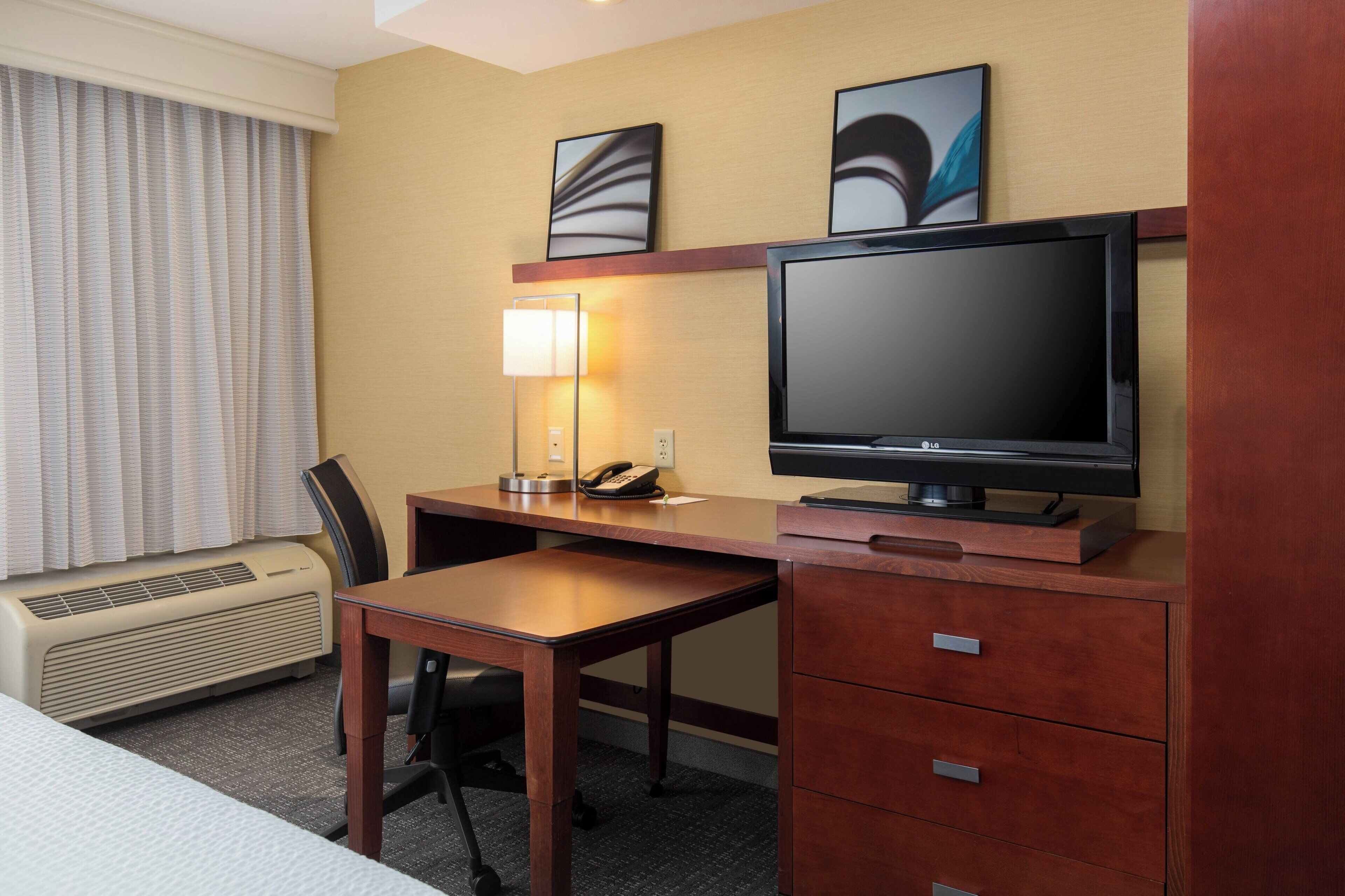 premium bedding, pillow-top beds, desk, laptop workspace
