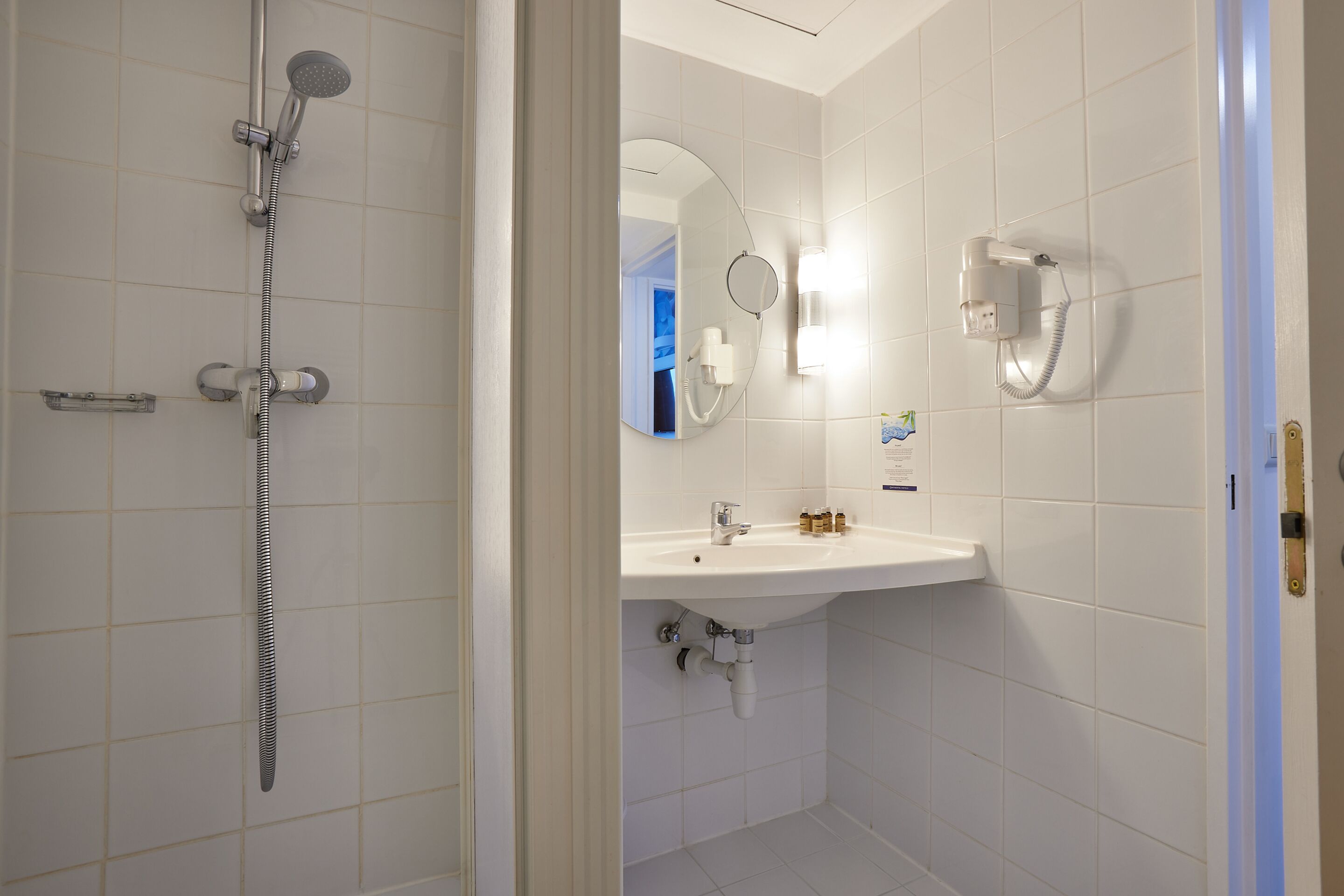 family suite | bathroom | shower, hair dryer, towels