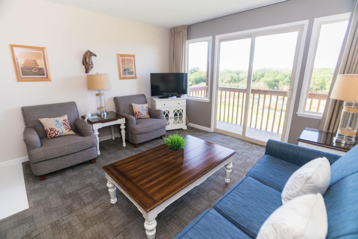 Suite, One Bedroom, 2nd Floor (Dog-Friendly) | Living room | 32-inch LCD TV with cable channels, TV, DVD player