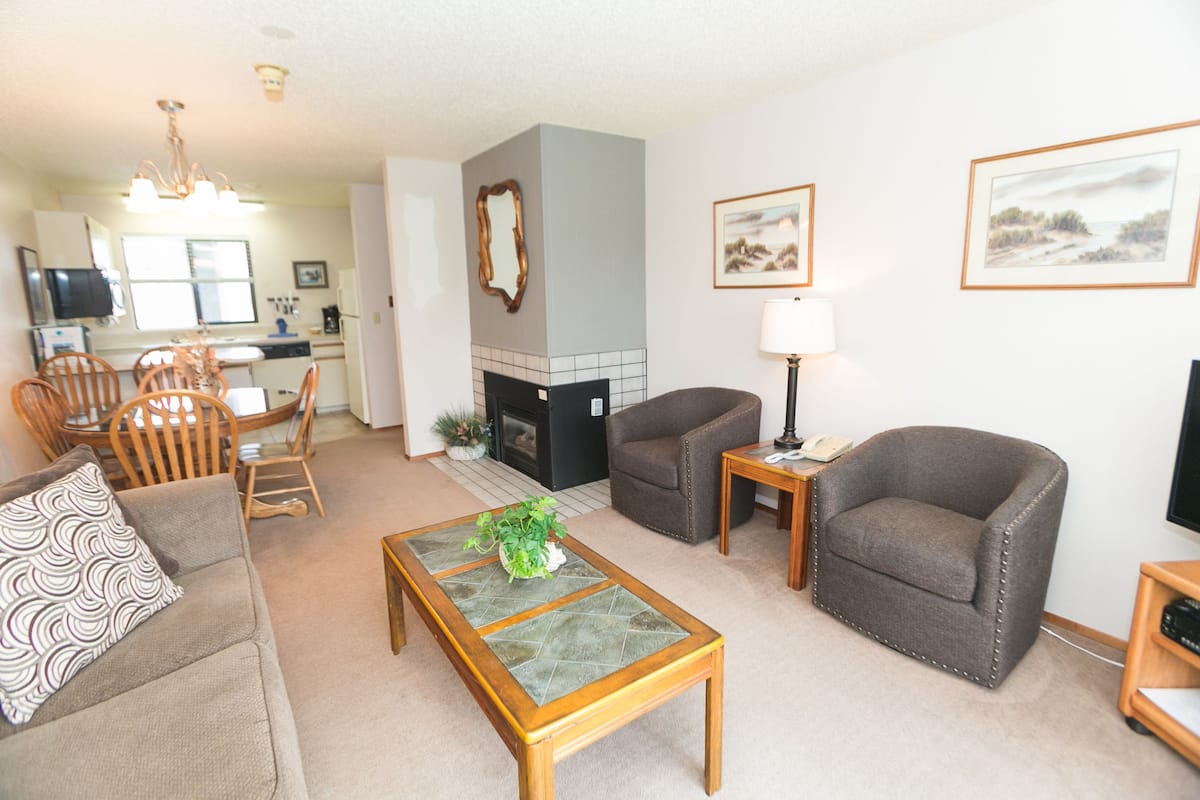 Suite, One Bedroom, 1st Floor (No Pets) | Living room | 32-inch LCD TV with cable channels, TV, DVD player
