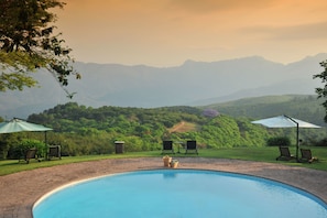 Indoor pool, outdoor pool, open 8 AM to 5 PM, pool umbrellas
