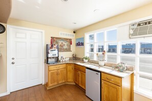 Enjoy a city view from the kitchen window, where you can make a fresh cup of coffee and enjoy the surrounding sights.