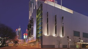 A modern building with a prominent Caesars sign, large windows, and a clean, white facade. - Caesars Windsor Hotel & Casino - A Caesars Rewards Destination (Windsor)