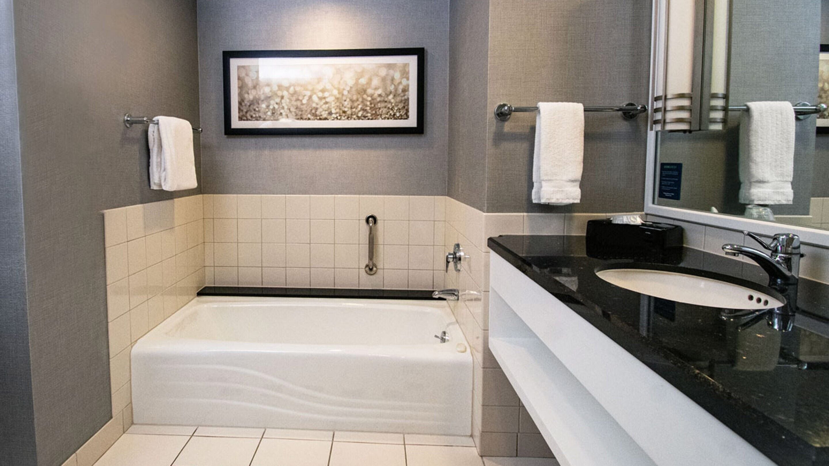 separate bathtub and shower, designer toiletries, hair dryer, towels