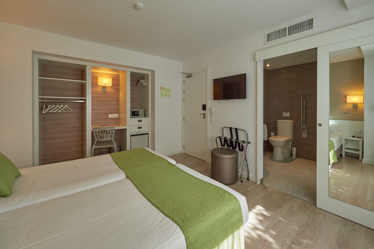 twin room, balcony | in-room safe, desk, soundproofing, iron/ironing board