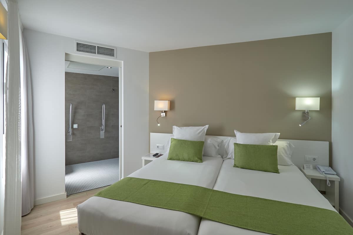 twin room, balcony | in-room safe, desk, soundproofing, iron/ironing board