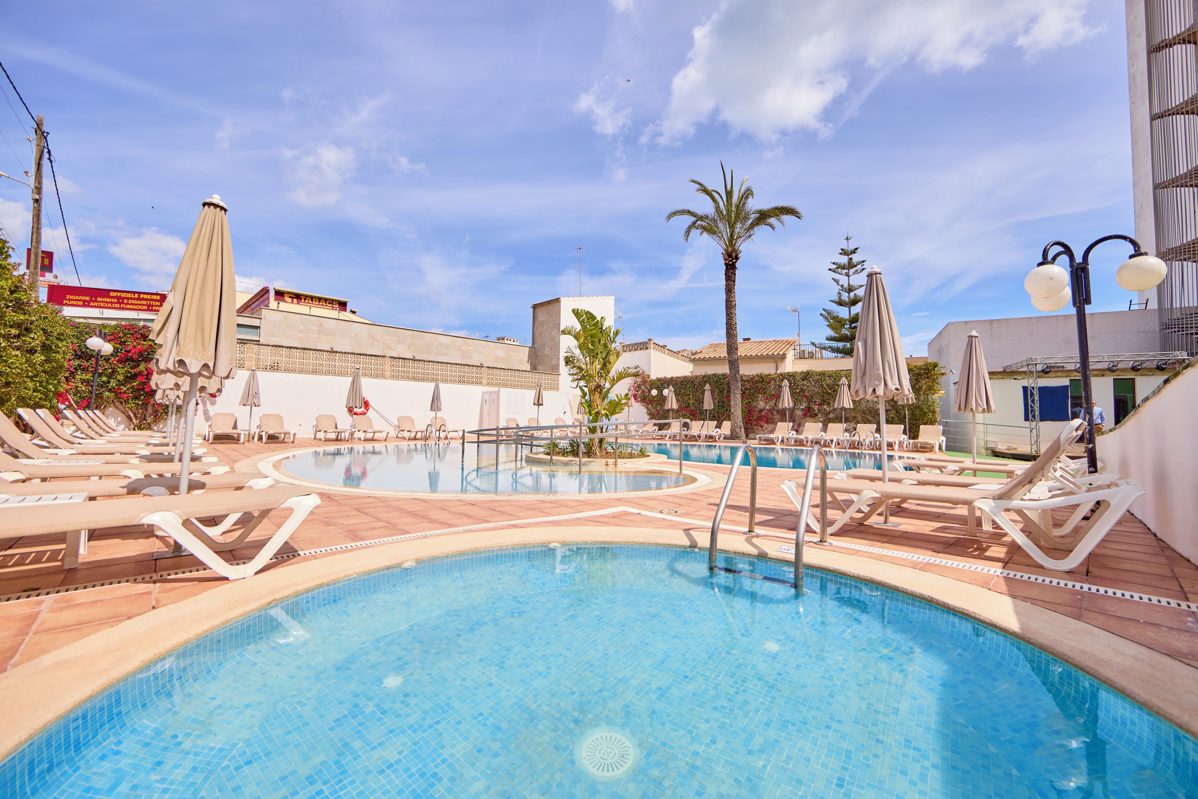 Indoor pool, outdoor pool, open 9:30 AM to 7:30 PM, pool umbrellas