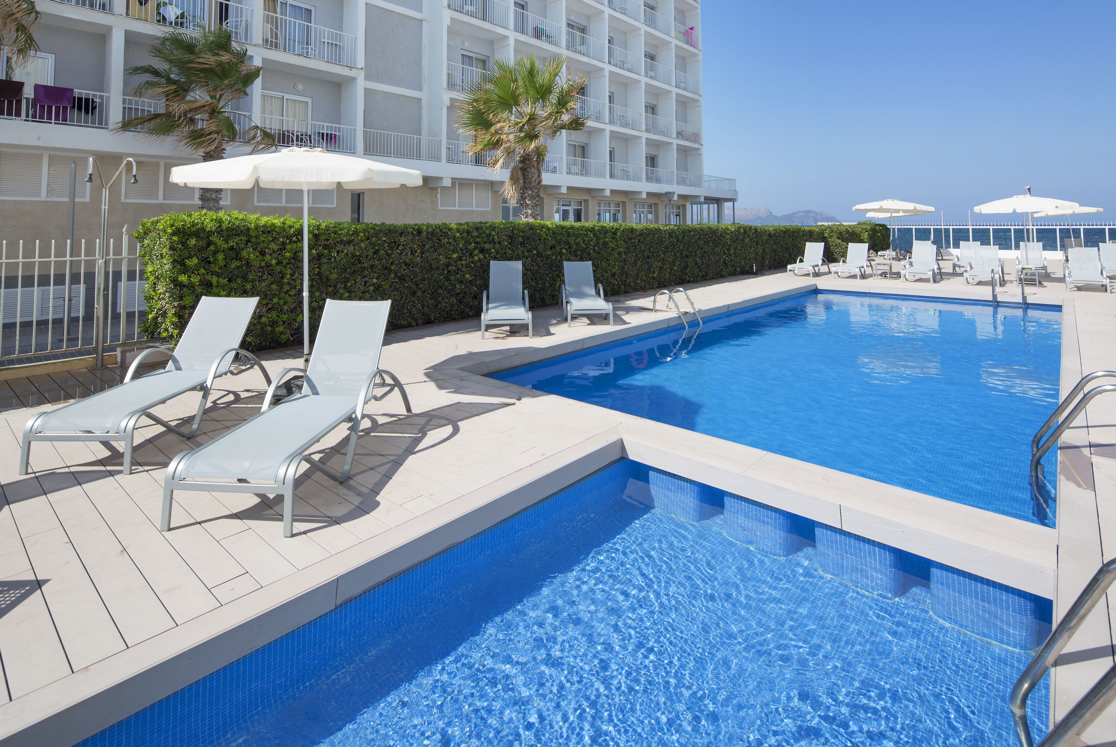 seasonal outdoor pool, pool umbrellas, pool loungers