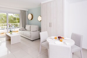 Apartment, 1 Bedroom, Balcony | Living area | 32-inch flat-screen TV with cable channels, TV
