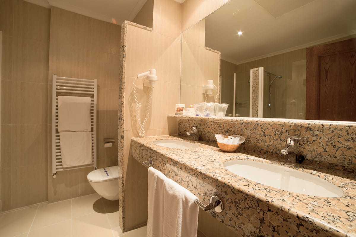 deep-soaking bathtub, free toiletries, hair dryer, towels