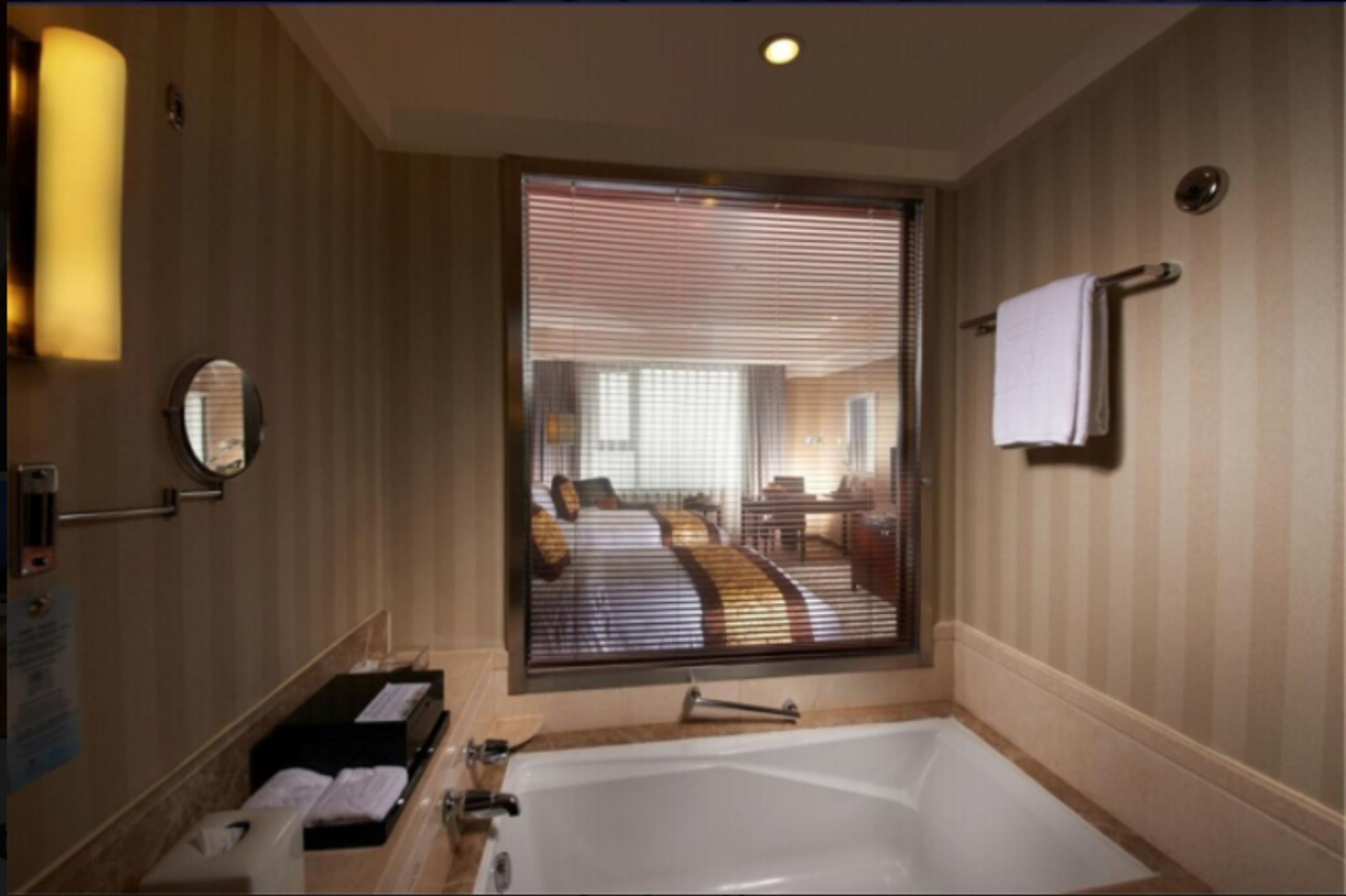 deep-soaking bathtub, designer toiletries, hair dryer, dressing gowns