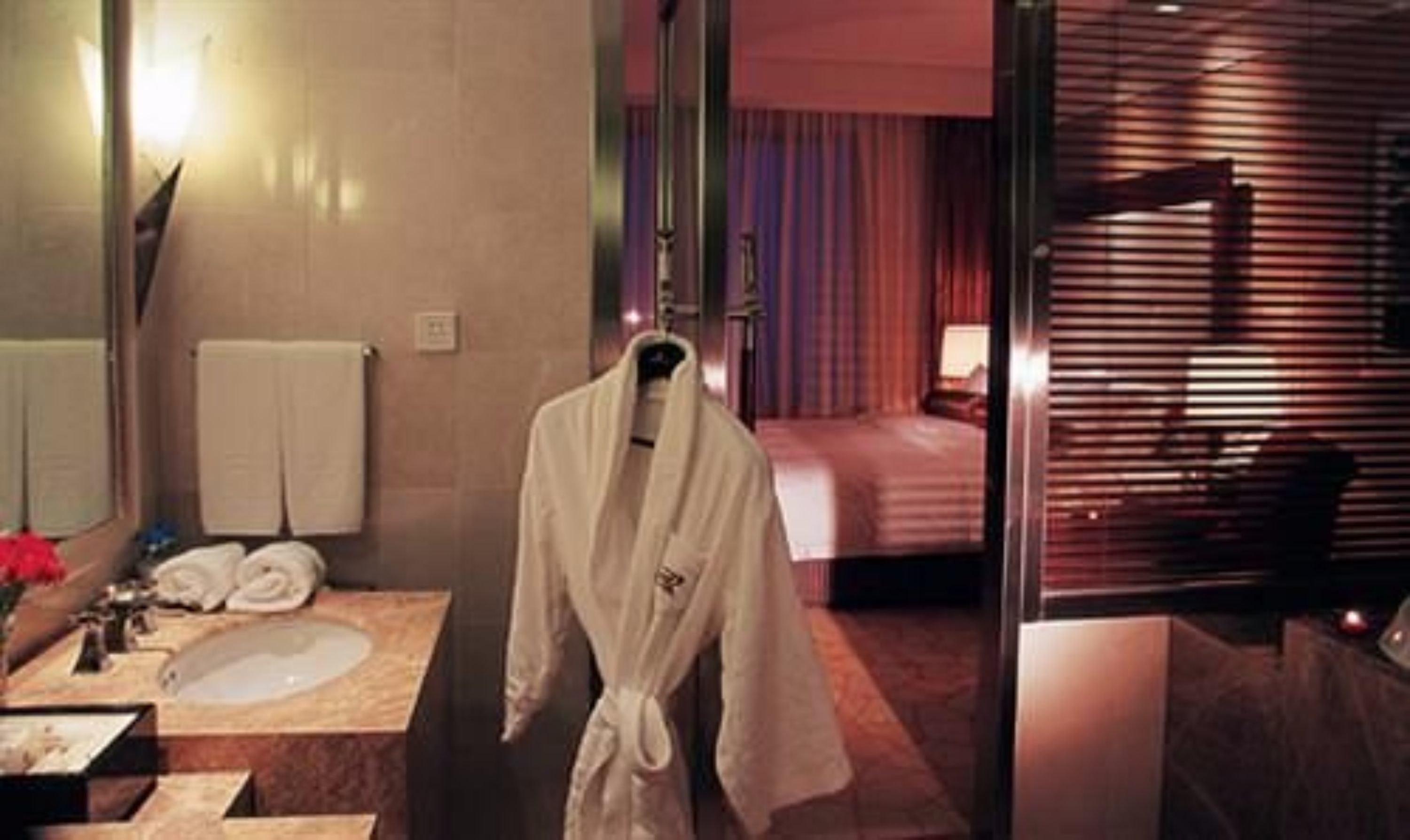 deep-soaking bathtub, designer toiletries, hair dryer, dressing gowns