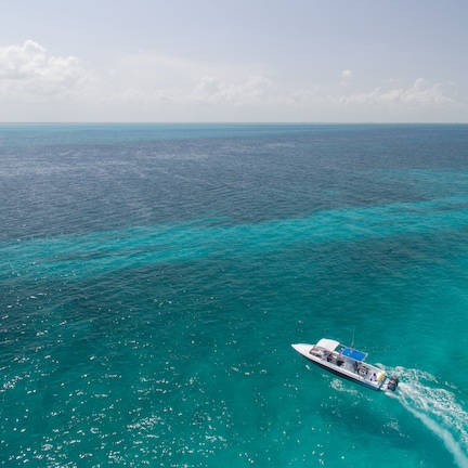 A boat on turquoise ocean waters.