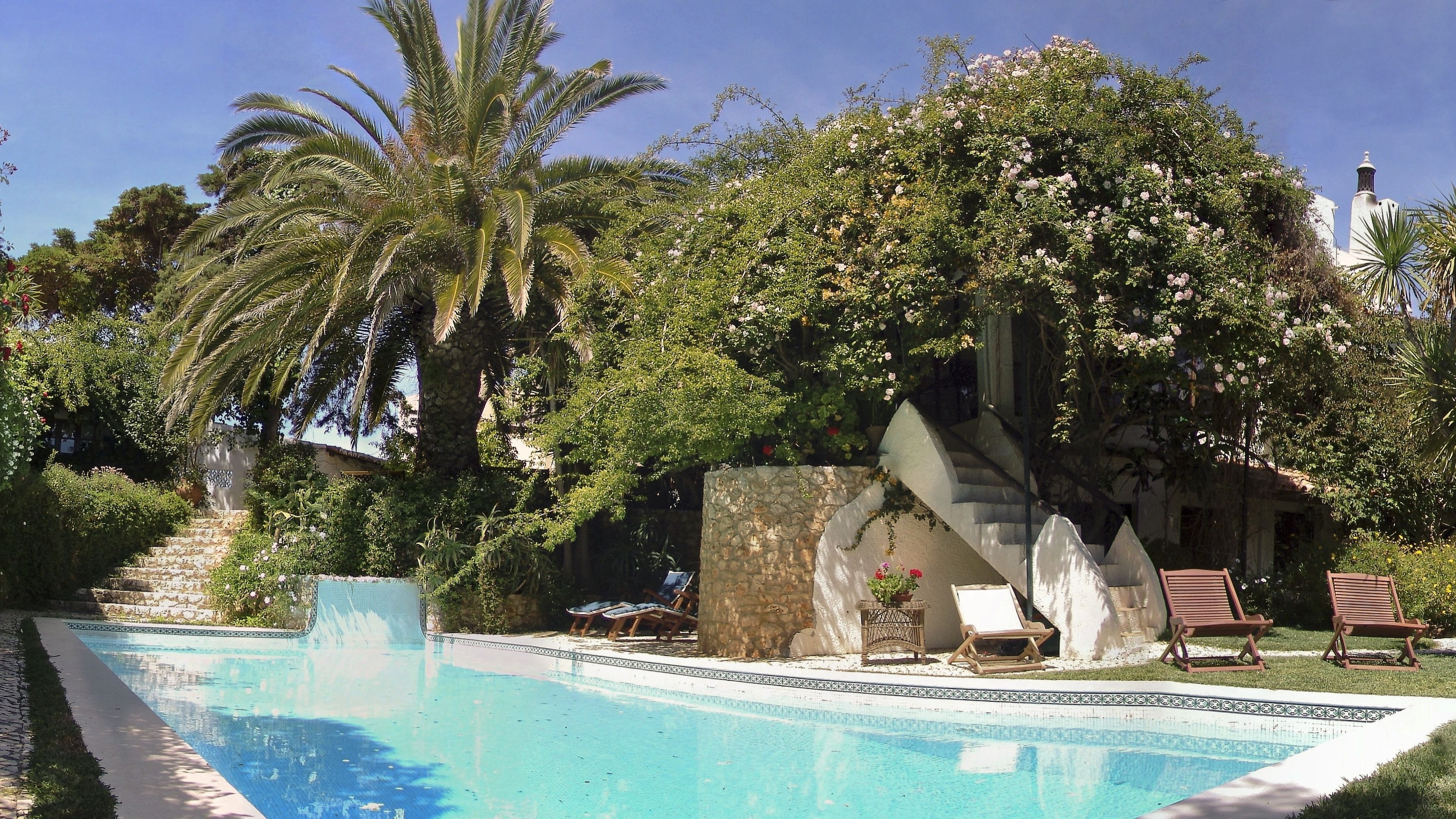 outdoor pool, pool umbrellas, pool loungers