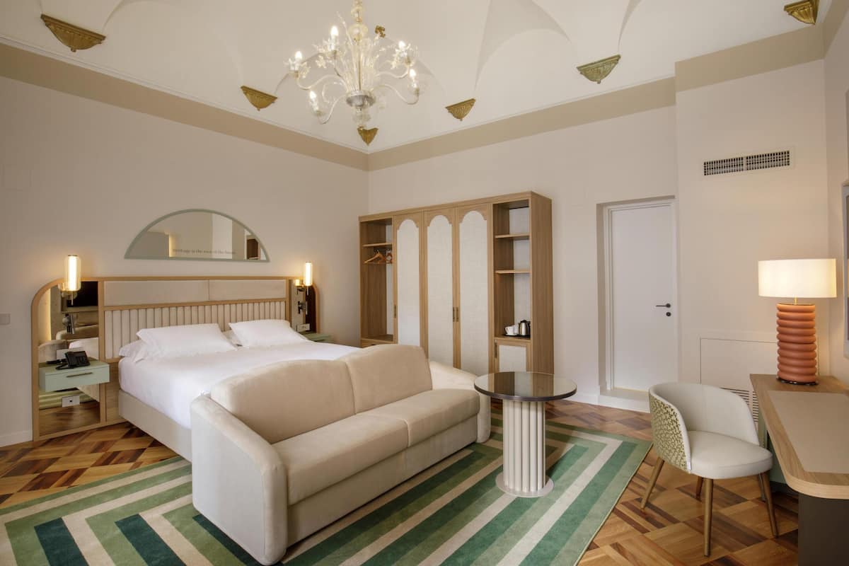 Junior Suite, 1 King Bed | Living area | 55-inch TV with satellite channels