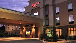 A Hampton Inn hotel with a modern facade, large windows, and a well-lit entrance. - Hampton Inn Indiana (Indiana)