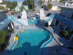 Outdoor pool, a heated pool, open 9:00 AM to 9:00 PM, pool umbrellas