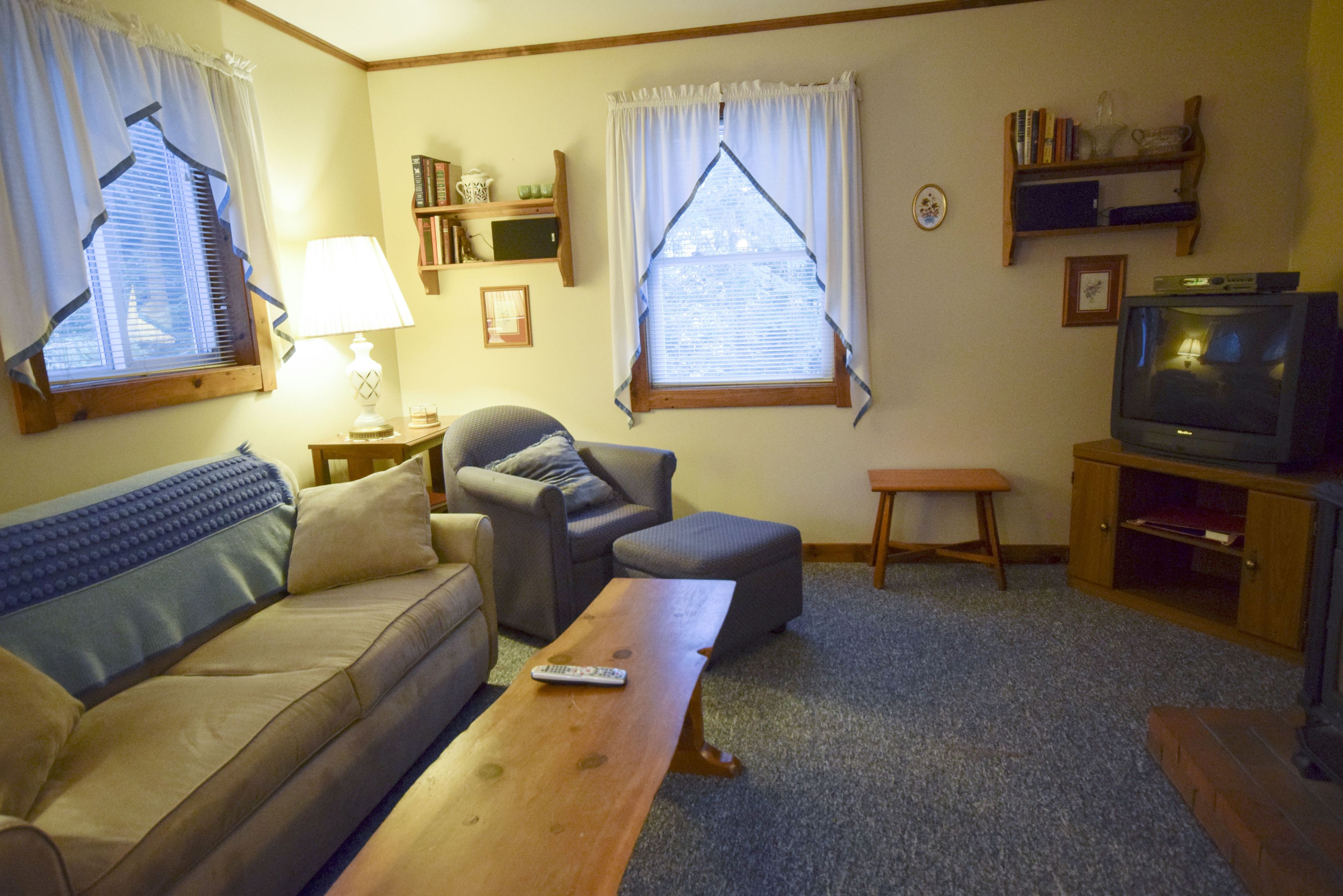 One Bedroom w/ King Bed & Sleeper Sofa | Living area | 32-inch TV with cable channels