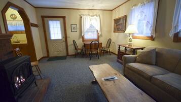 One Bedroom w/ King Bed & Sleeper Sofa | Living area | 32-inch TV with cable channels