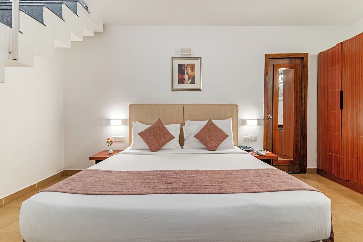 Chambre familiale, 2 lits doubles | Coffre-fort, rideaux d’obscurcissement, fer et planche à repasser
