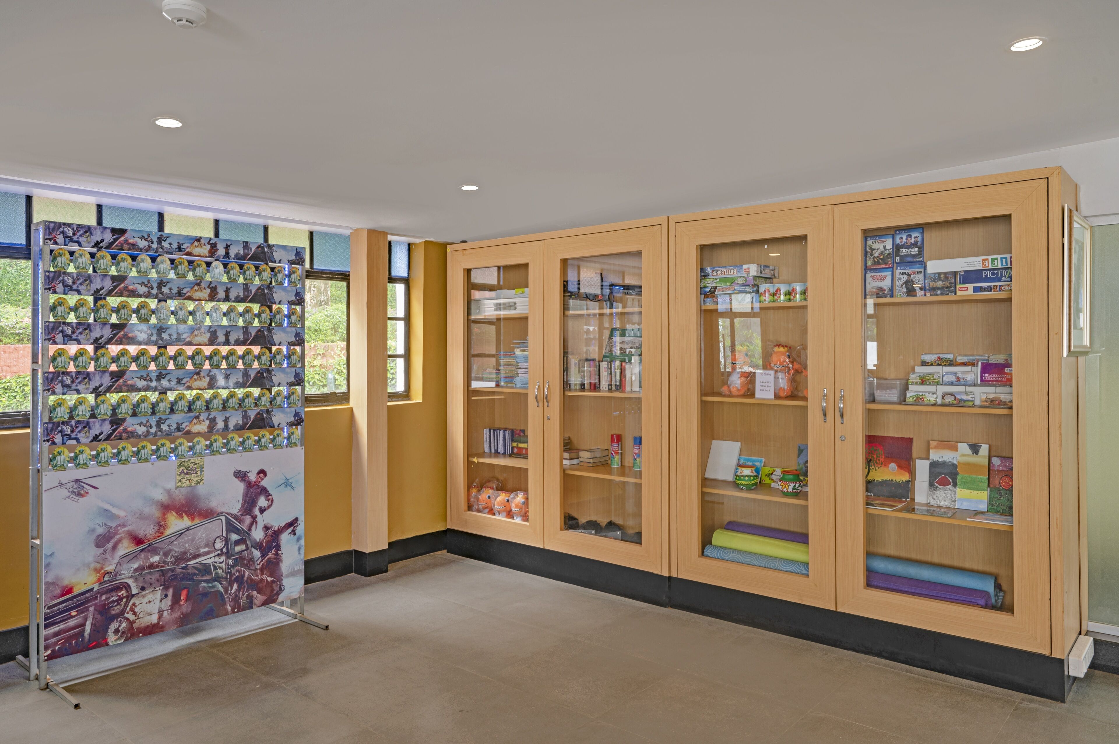 A library with wooden cabinets containing books and magazines.