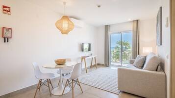 Premium Studio, Sea View, Sea Facing | Living area | 50-inch flat-screen TV with cable channels, TV